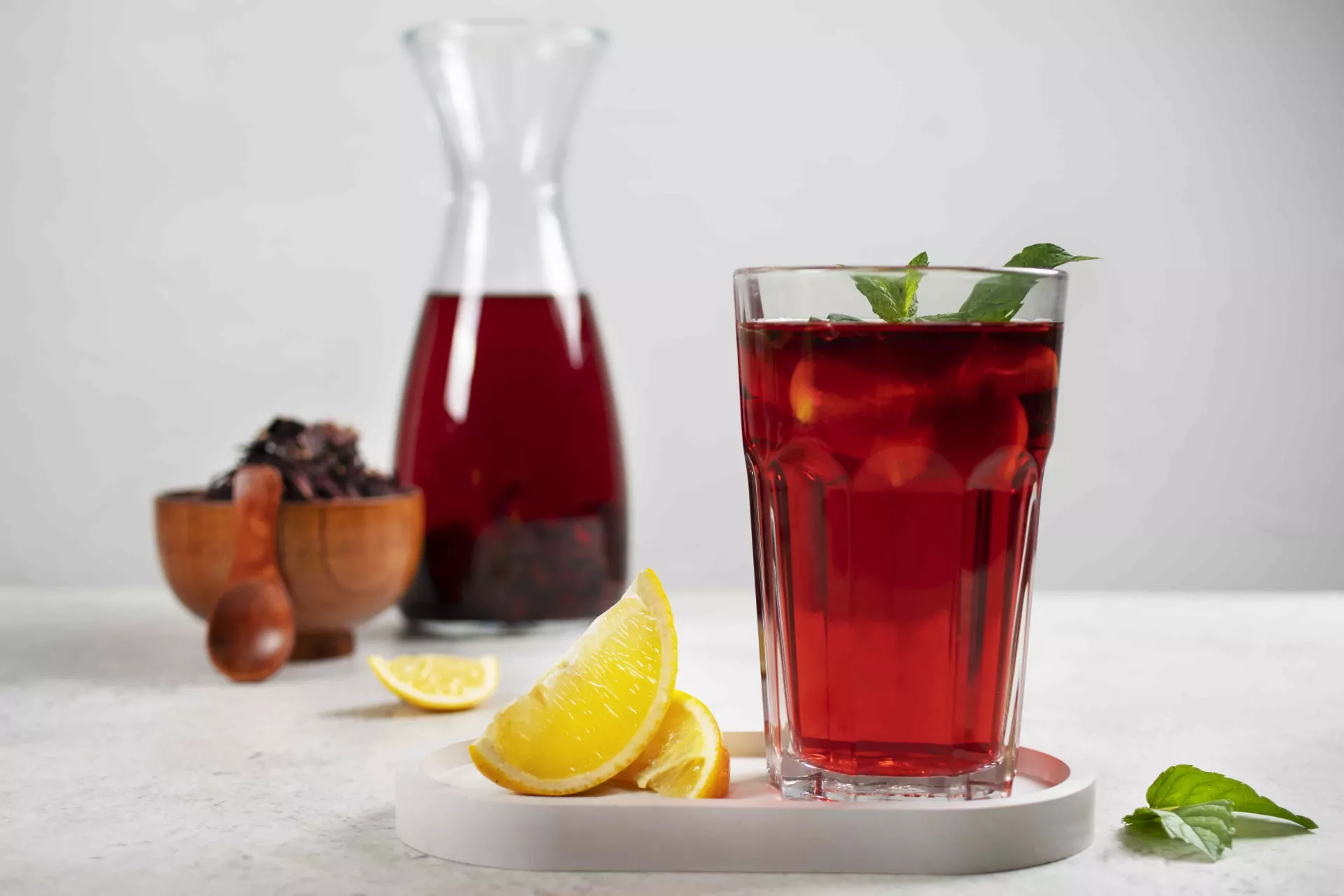 refreshing-hibiscus-ice-tea-in-clear-glass-container-min.jpg