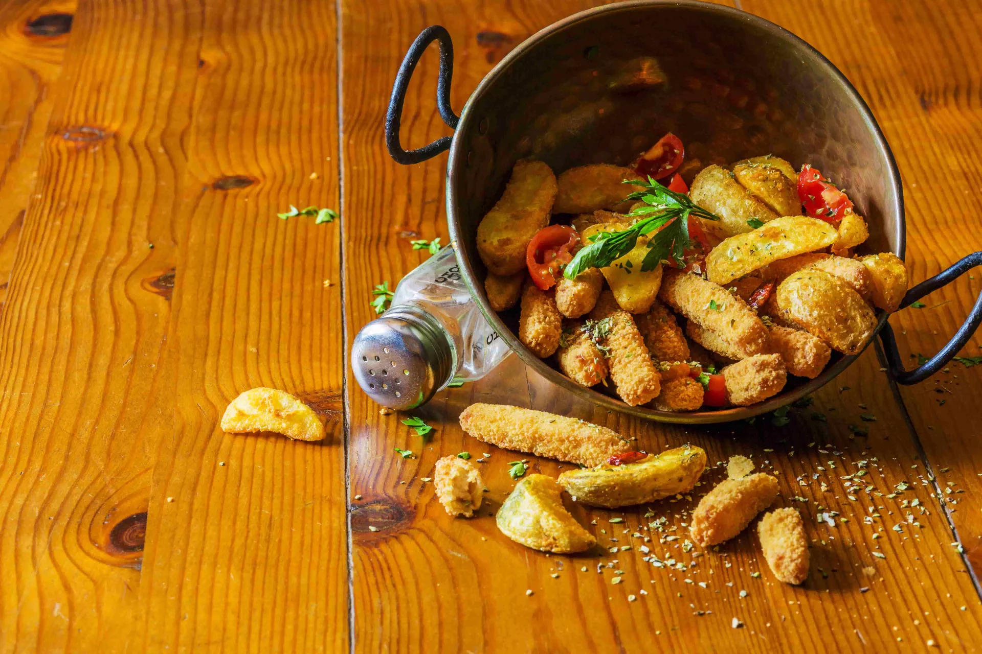 spilled-fried-potato-wedges-from-the-copper-utensil (1)-min.jpg
